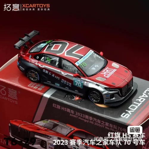 Red diecast race car model with black wheels and front grille, side view