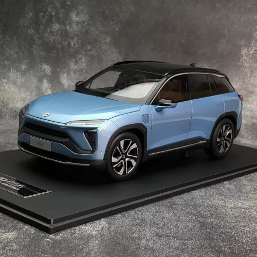 Metallic blue diecast SUV model car with black grille and wheels, front view