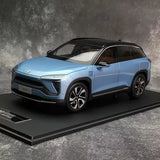 Metallic blue diecast SUV model car with black grille and wheels, front view