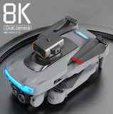 Gray compact quadcopter drone with forward camera module and blue LED lights