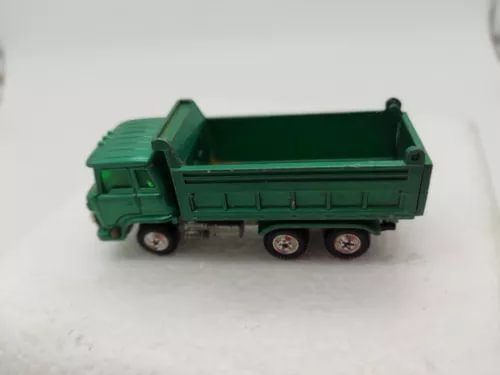 Green tandem dump truck diecast model, dump bed lifted, 1/102 scale