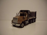 Diecast model dump truck with raised bed and tri-axle trailer, dark brown cab