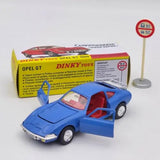 Blue diecast model sports car with open door and red interior, front-left view