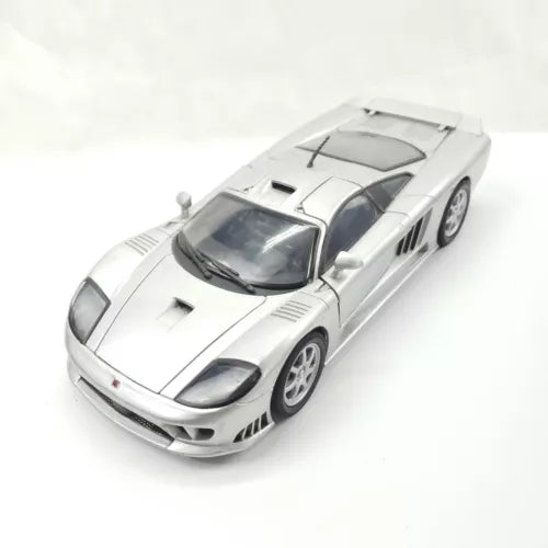 Silver 1/24 scale diecast sports car model with black hood vents and front splitter