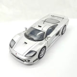 Silver 1/24 scale diecast sports car model with black hood vents and front splitter