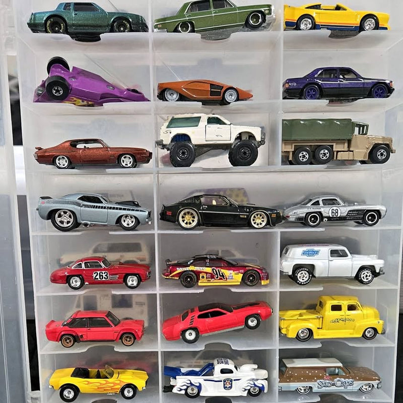 Diecast car display case with multiple colorful miniature cars in grid compartments