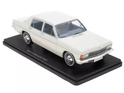 1:24 diecast sedan model car in light cream, on black display base