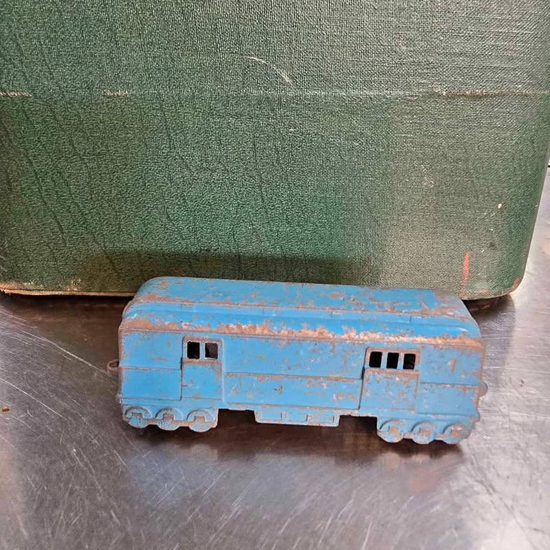 Vintage blue diecast toy bus with molded windows and wheels