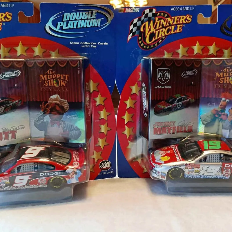 Diecast toy cars in retail boxes, race car models with numbers 9 and 19