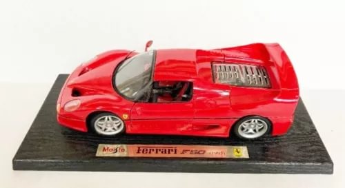 Red Maisto diecast Ferrari F60 model car with moving parts