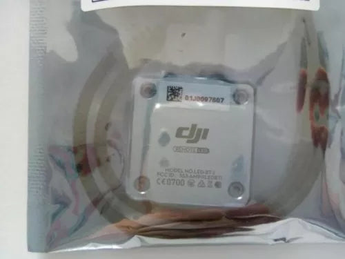 DJI LED drone controller module with DJI logo and label, mounted screws