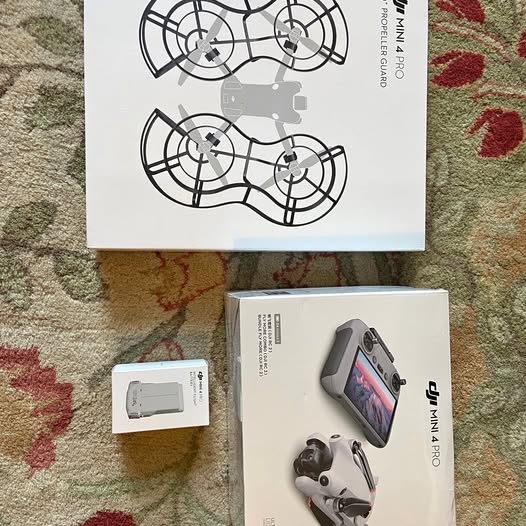 DJI Mini 4 Pro drone and RC 2 remote with built-in screen, boxed