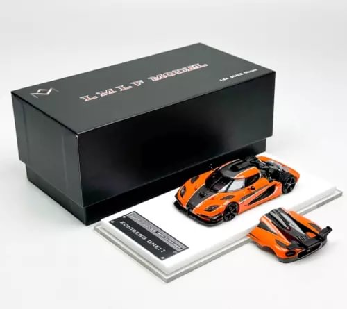 Orange and black 1:64 diecast sports car model with display box and card