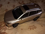 Gold 1:18 scale diecast SUV model with black windows and wheels