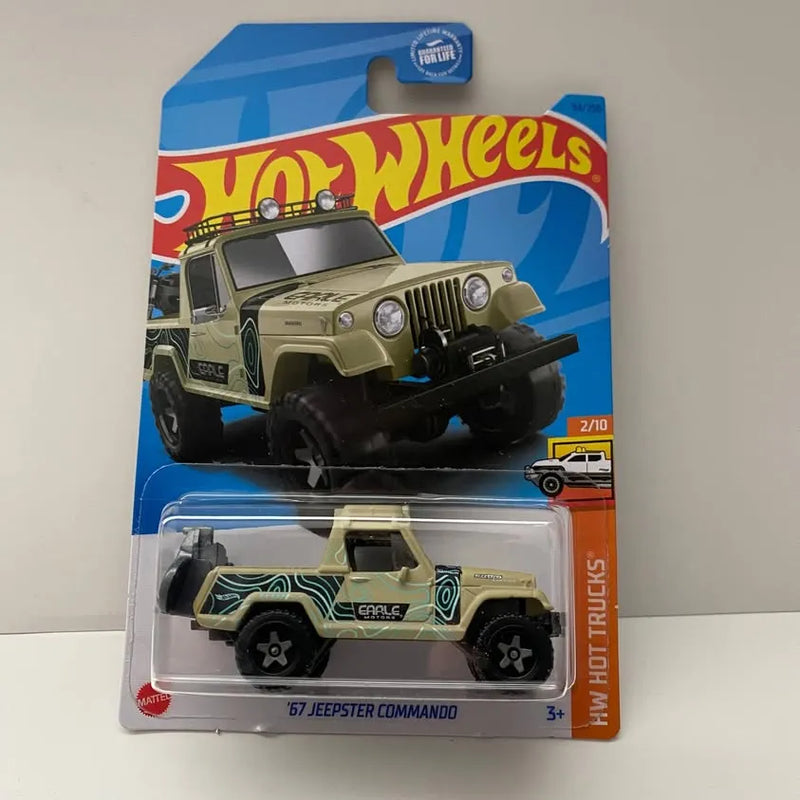 Green and tan diecast toy Jeepster Commando truck in clear blister package