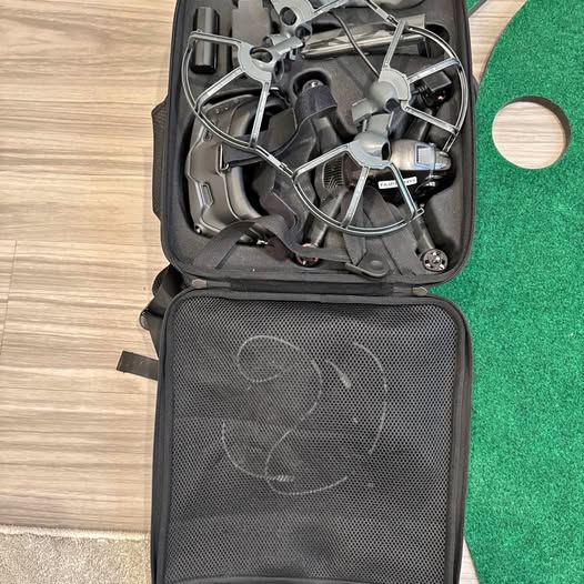FPV drone with propeller guard in black carrying case