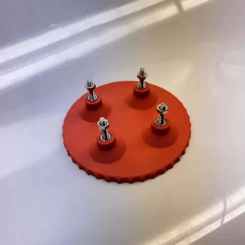 Drone ESC/FC holder: red circular base with four mounting standoffs and screws
