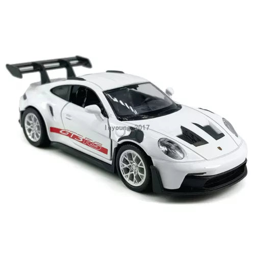 White diecast race car model with black hood and racing stripes, front three-quarter view.