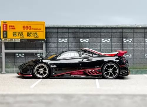 1:64 scale racing sports diecast car, black with red accents and rear spoiler