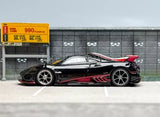 1:64 scale racing sports diecast car, black with red accents and rear spoiler