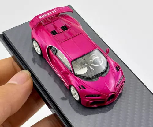 Pink Bugatti Chiron 1:64 diecast sports car toy, front view in display case