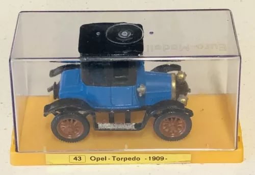Blue diecast Opel Torpedo 1909 car in clear display case with base label
