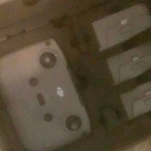 DJI drone underside with circular ports and panel details