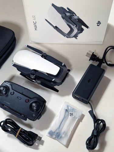 DJI Mavic Air drone in arctic white, with black controller and cables (no battery)