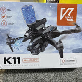 Black camera drone with four propellers and attached front shooter module