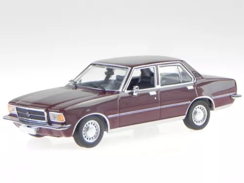 Dark red diecast sedan model car with chrome grille, side view