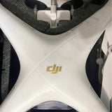 White DJI drone body with front arms and dji logo