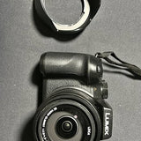 Compact camera device with circular lens and side controls