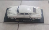White 1:18 scale Tucker diecast car model on display base, detailed body