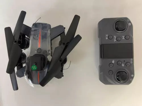 Foldable quadcopter drone with camera and gray remote controller