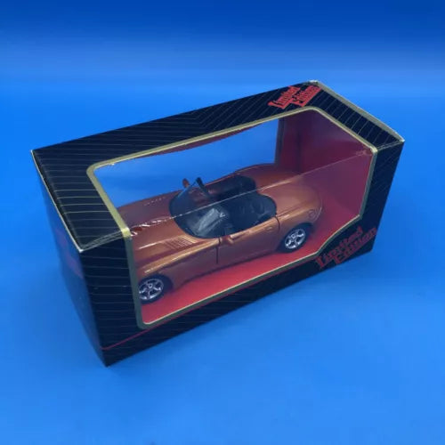 Brown diecast concept car toy in retail display box with clear window