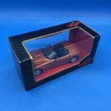 Brown diecast concept car toy in retail display box with clear window