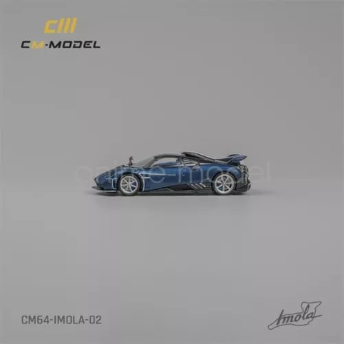 Blue sports car diecast model with silver wheels, side view, detailed body