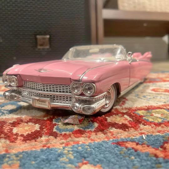 Pink diecast 1959 Cadillac Eldorado Biarritz convertible model car, front view