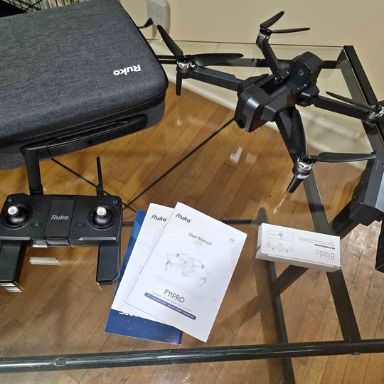 Ruko f11PRO drone with controller, manuals, and storage case