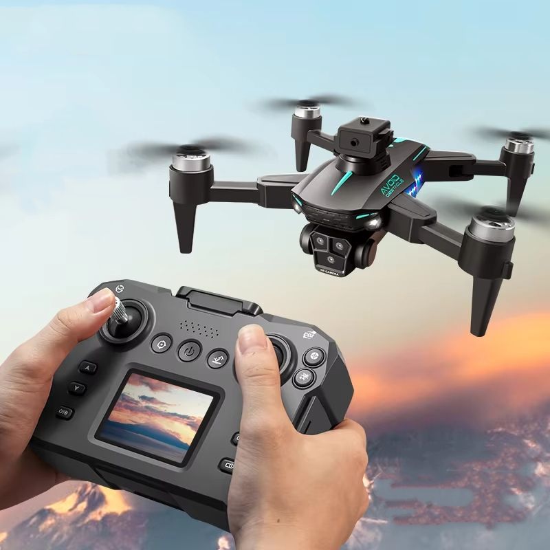 Gray mini quadcopter drone with triple camera module and handheld controller with screen