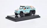 1/64 scale Mercedes-Benz G63 6x6 AMG diecast toy, mint blue with orange stripe, on base