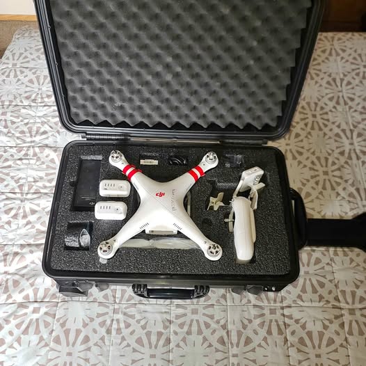 DJI Phantom 2 drone in hard case with two batteries and propeller arms