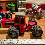 Red Massey Ferguson 4900 diecast tractor with large black tires and silver details