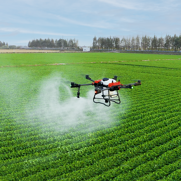 Sprayer drone with four rotors, emitting mist over green crops