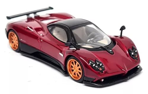 Red Pagani Zonda F diecast model car with orange wheels, front view