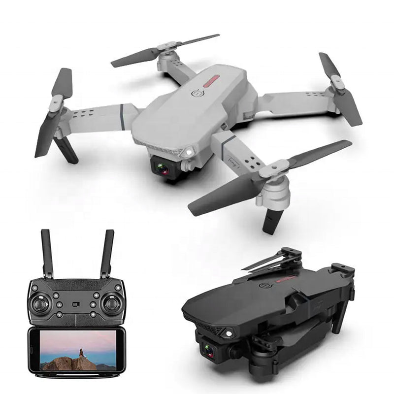 Foldable quadcopter drone with front camera and four propeller arms, plus controller screen