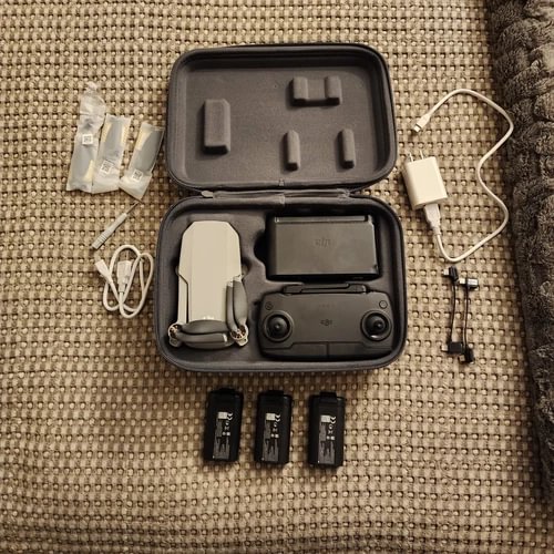 DJI Mavic Mini drone kit in hard case with controller, 3 batteries, cables, and charger