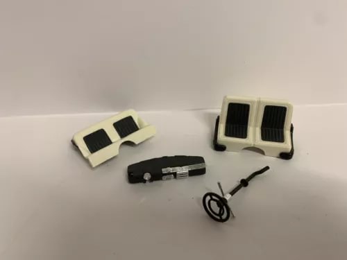 1/28 scale diecast car interior parts set with seats, dash pieces, and steering wheel