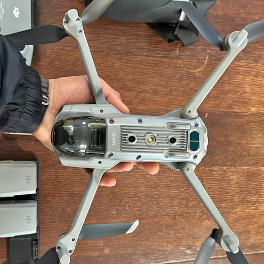 DJI Mavic Air 2 drone with front camera and four propeller arms, gray body