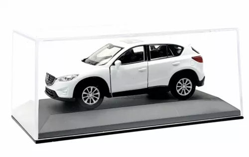 Bright white diecast SUV toy car, side view, in clear display box